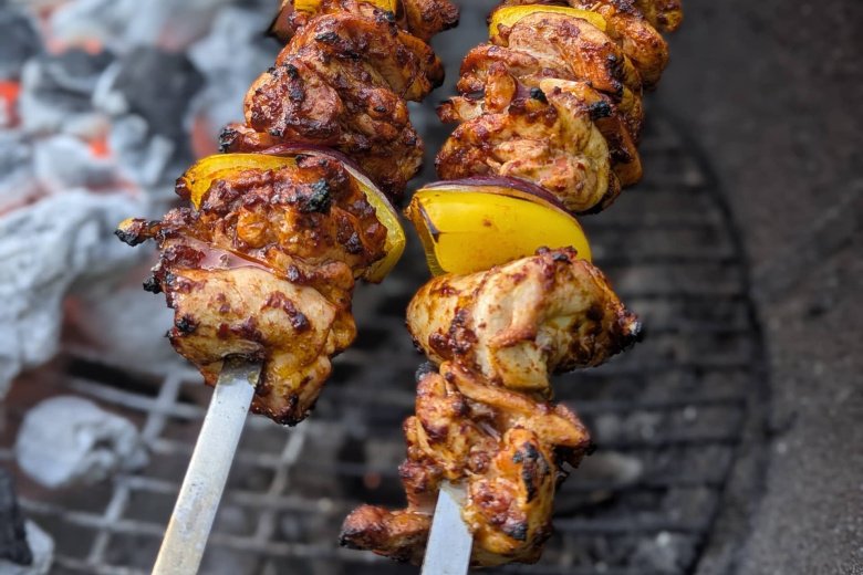 Sour Cherry Harissa Chicken Kebab cooking over charcoal
